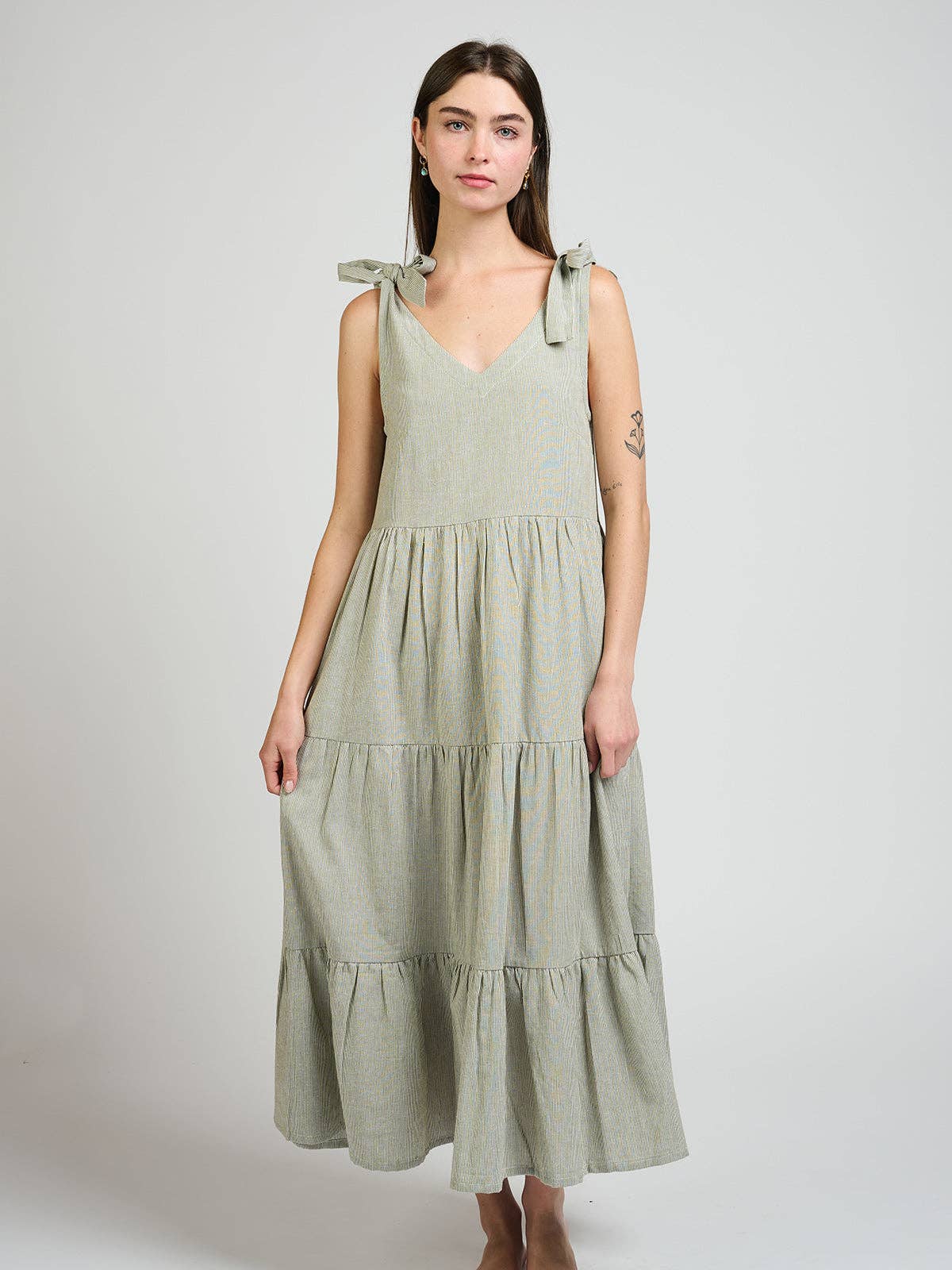 Woman wearing a green dress on a white background
